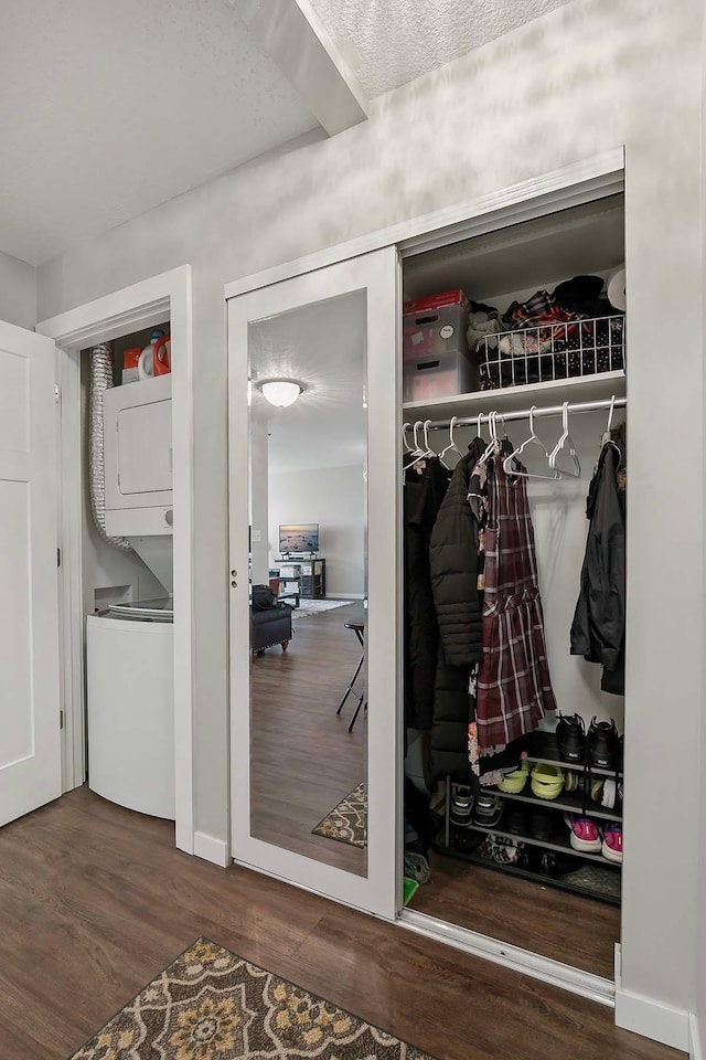 closet with stacked washer / drying machine