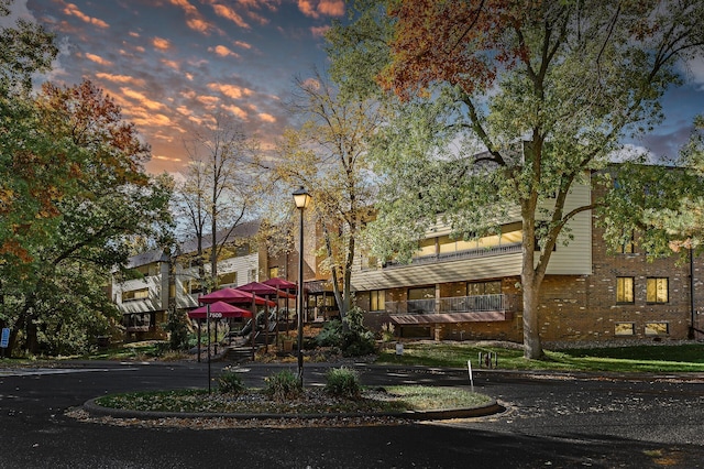 view of outdoor building at dusk