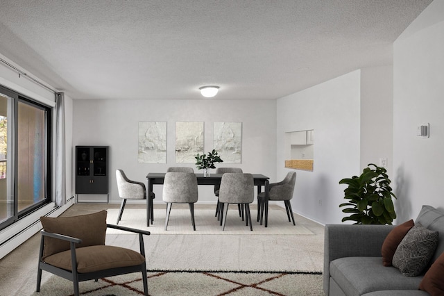 carpeted dining space with a textured ceiling