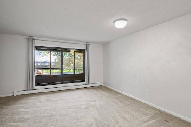 7500 Cahill Rd Unit 202C, Edina, MN 55439 - spare room featuring a baseboard heating unit, a textured ceiling, carpet, and baseboards