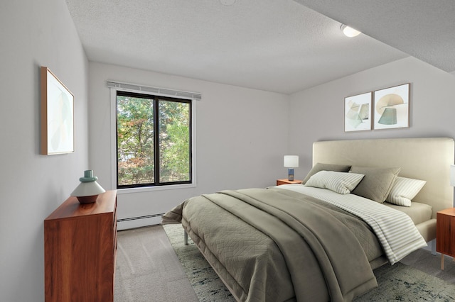 carpeted bedroom with a baseboard heating unit and a textured ceiling