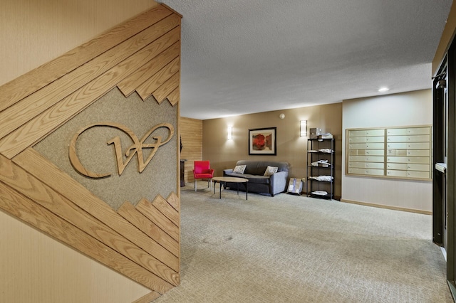 sitting room featuring a textured ceiling and light carpet