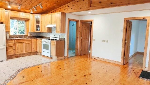 kitchen featuring lofted ceiling, light wood-type flooring, wood ceiling, white appliances, and track lighting