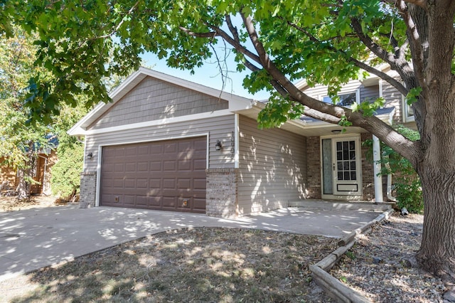 ranch-style home featuring a garage