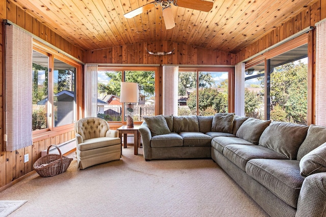 sunroom / solarium featuring ceiling fan, wooden ceiling, and lofted ceiling