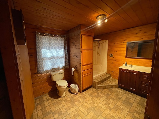 bathroom with vanity, wood ceiling, wooden walls, walk in shower, and toilet