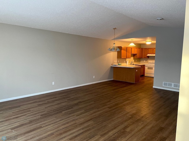 interior space featuring pendant lighting, lofted ceiling, dark wood-type flooring, white electric range oven, and a textured ceiling