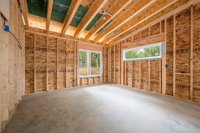 misc room with concrete flooring