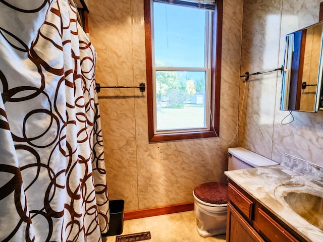 bathroom with vanity, toilet, and a shower with shower curtain