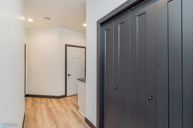 hall with light hardwood / wood-style flooring