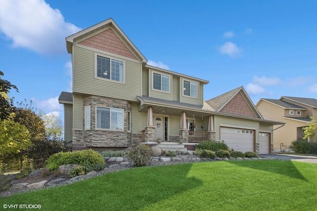 craftsman-style home featuring a porch, a garage, and a front yard