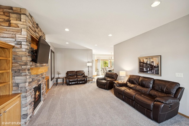 living room featuring a fireplace and carpet floors