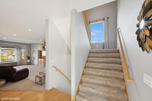 staircase with wood-type flooring