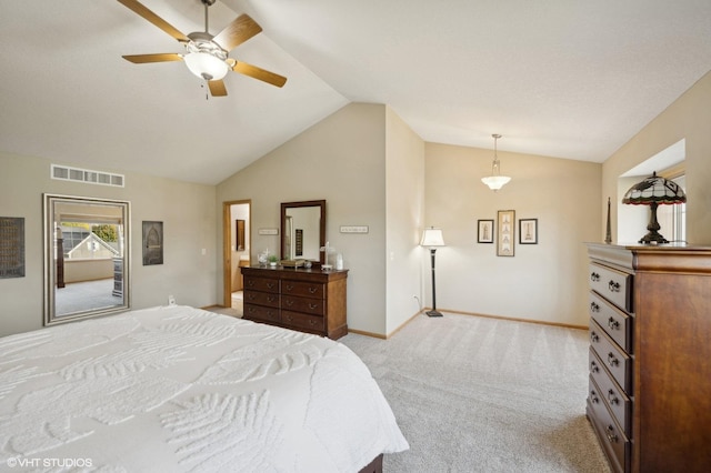 bedroom featuring light carpet, vaulted ceiling, and ceiling fan