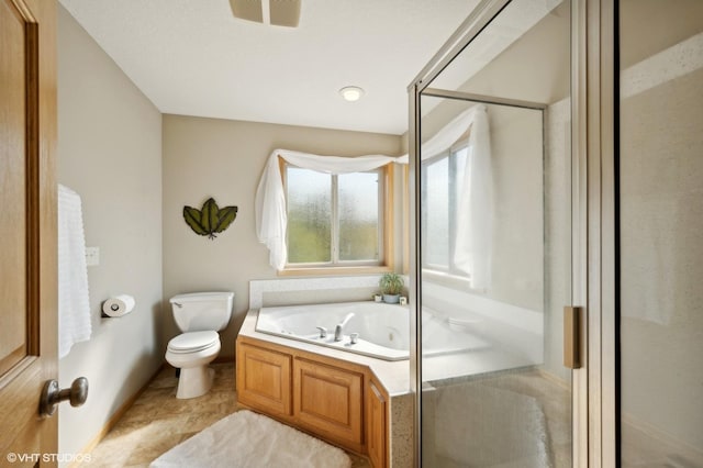 bathroom featuring toilet and separate shower and tub