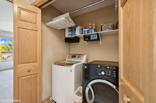 clothes washing area with washer and dryer