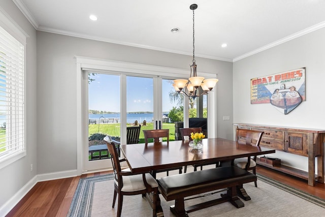 2172 Shadywood Rd, Orono, MN 55391 - dining space with wood finished floors, a chandelier, crown molding, recessed lighting, and baseboards