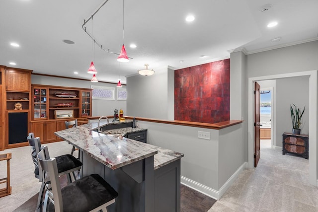 2172 Shadywood Rd, Orono, MN 55391 - kitchen with a sink, ornamental molding, recessed lighting, light stone countertops, and a large island with sink