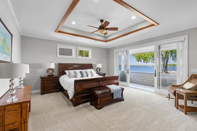 2172 Shadywood Rd, Orono, MN 55391 - bedroom featuring light carpet, access to exterior, a tray ceiling, ornamental molding, and a water view