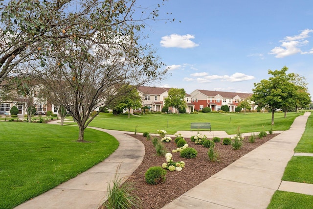 view of property's community with a yard