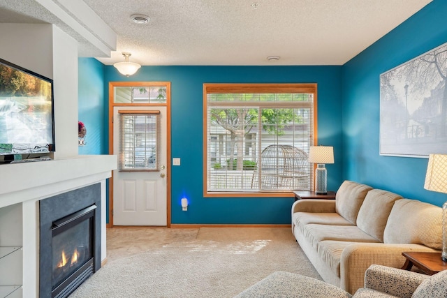 living room with light colored carpet and a textured ceiling