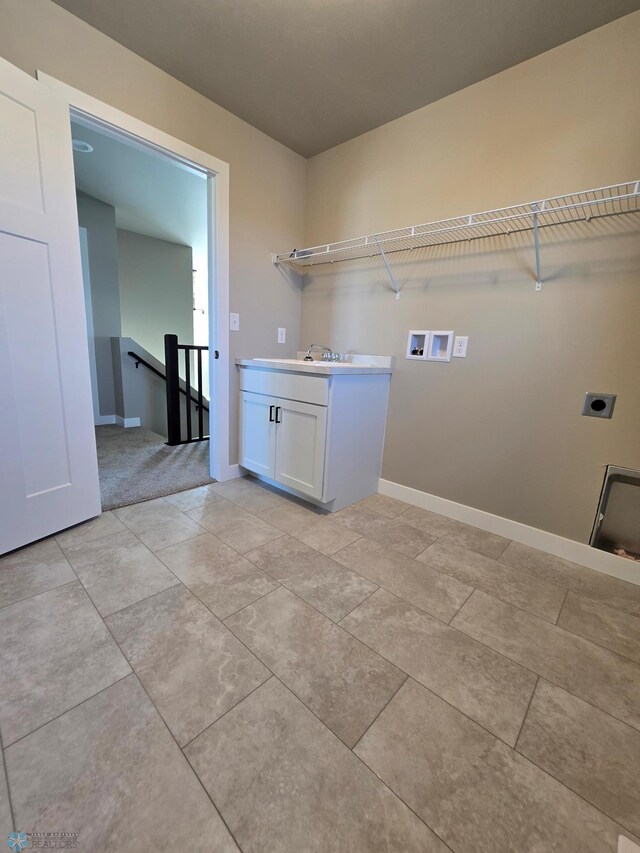 6379 83rd Ave S, Fargo, ND 58047 - laundry room with washer hookup, sink, and electric dryer hookup