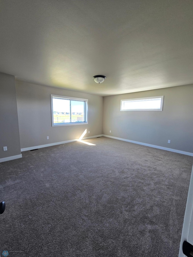 6379 83rd Ave S, Fargo, ND 58047 - spare room with dark colored carpet