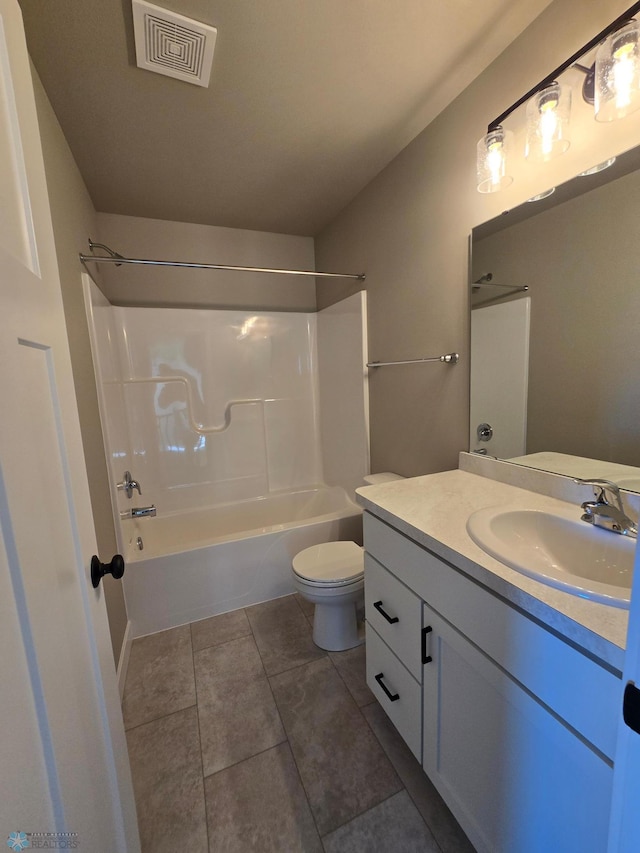 6379 83rd Ave S, Fargo, ND 58047 - full bathroom with tile patterned flooring, toilet, washtub / shower combination, and vanity