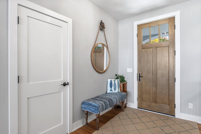 foyer entrance featuring a textured ceiling and hardwood / wood-style floors