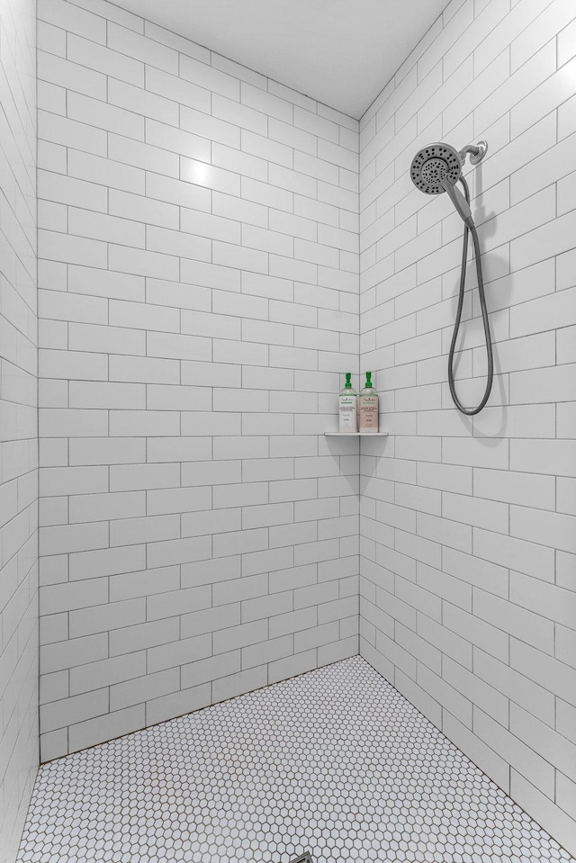 bathroom with a tile shower