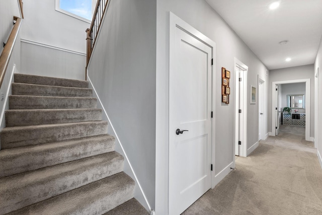 staircase with carpet floors