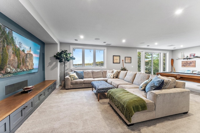 carpeted living room featuring pool table