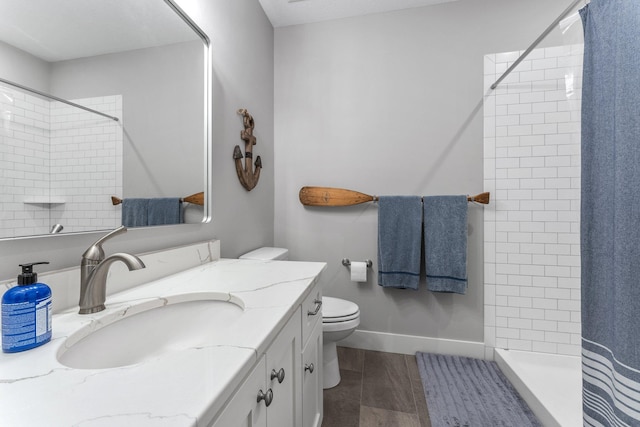 bathroom with vanity, hardwood / wood-style floors, toilet, and curtained shower