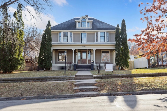 view of front of home featuring a porch and a front yard