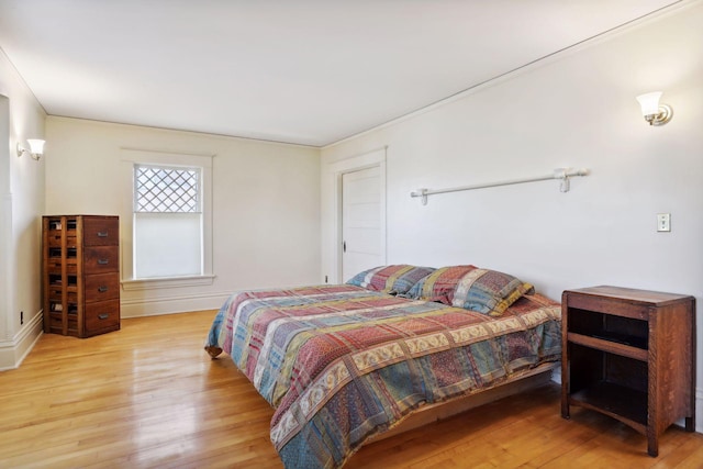 bedroom with light hardwood / wood-style floors