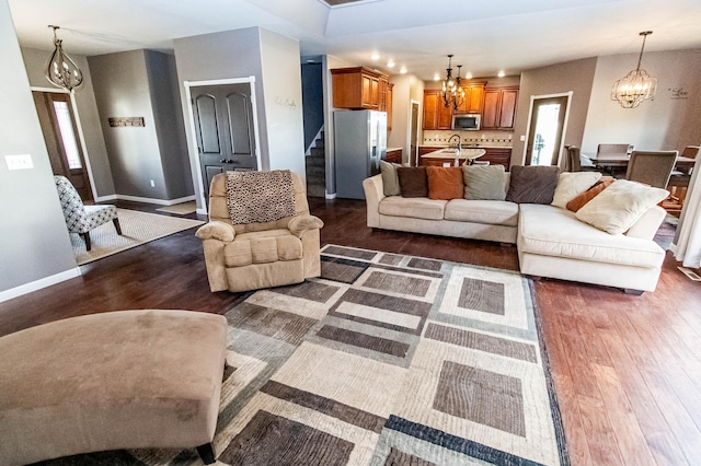 living room with dark hardwood / wood-style floors and sink