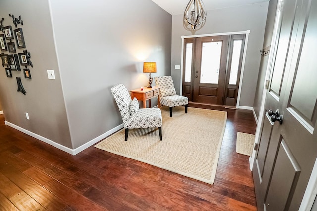 entryway featuring a chandelier and dark wood-type flooring