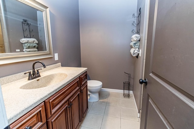 bathroom with tile patterned floors, vanity, and toilet