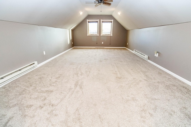 additional living space featuring ceiling fan, light colored carpet, lofted ceiling, and baseboard heating