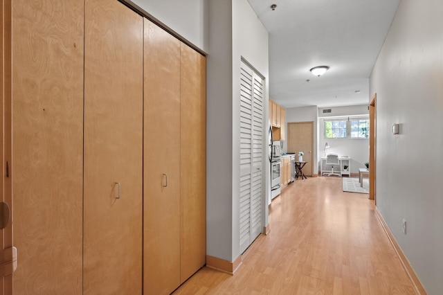 hall featuring light hardwood / wood-style floors