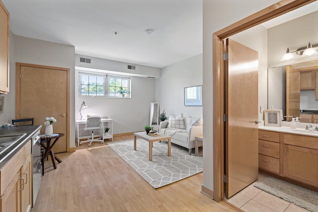 bathroom featuring sink and wood-type flooring