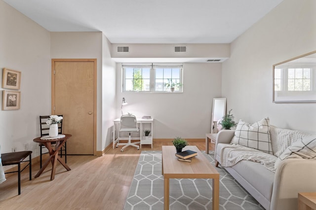 living room with light hardwood / wood-style floors