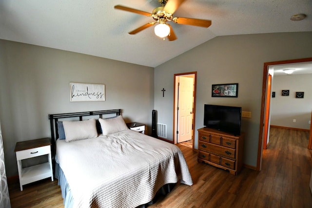 bedroom featuring ceiling fan, vaulted ceiling, and dark hardwood / wood-style flooring