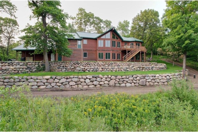 back of property with a wooden deck