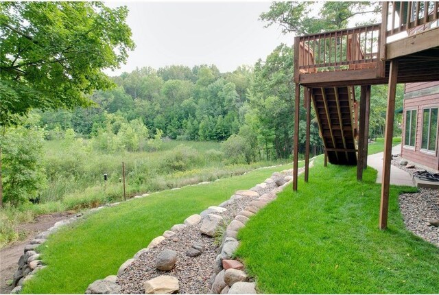 view of yard featuring a wooden deck