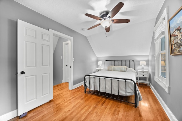 4512 47th Ave S, Minneapolis, MN 55406 - bedroom featuring vaulted ceiling, wood finished floors, baseboards, and a ceiling fan