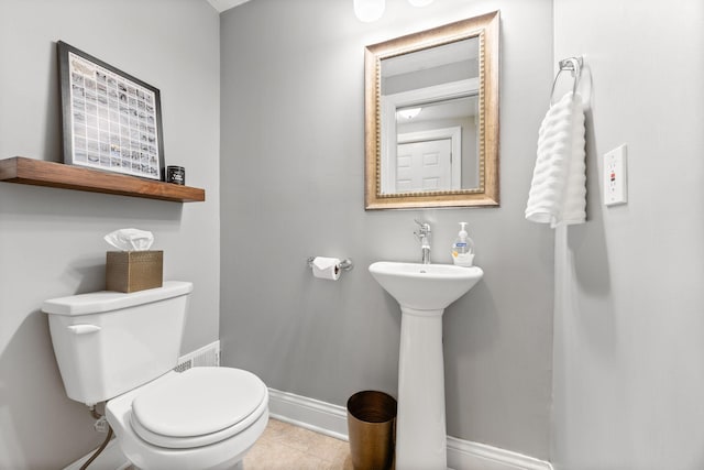 4512 47th Ave S, Minneapolis, MN 55406 - half bathroom with toilet, baseboards, and tile patterned floors