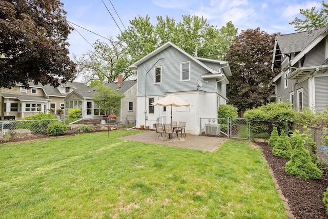 4512 47th Ave S, Minneapolis, MN 55406 - rear view of house with central AC unit, a gate, and a patio