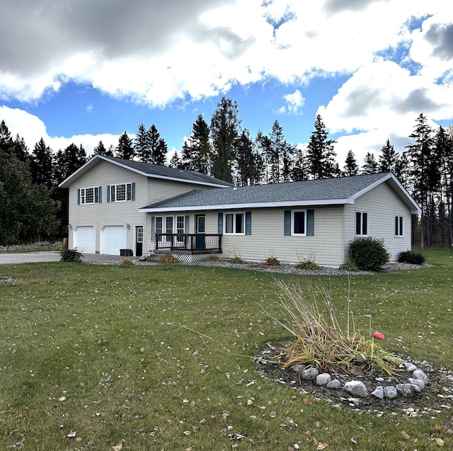 view of front of home featuring a garage and a front lawn