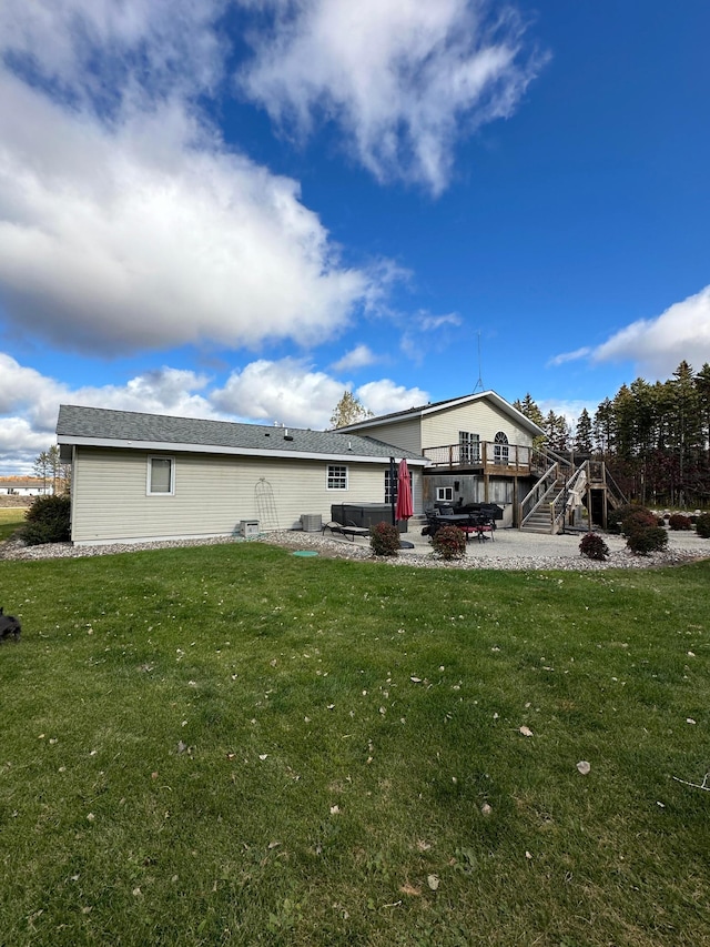 back of property featuring a lawn